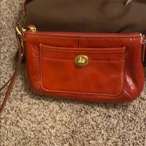 Coach red patent leather wristlet